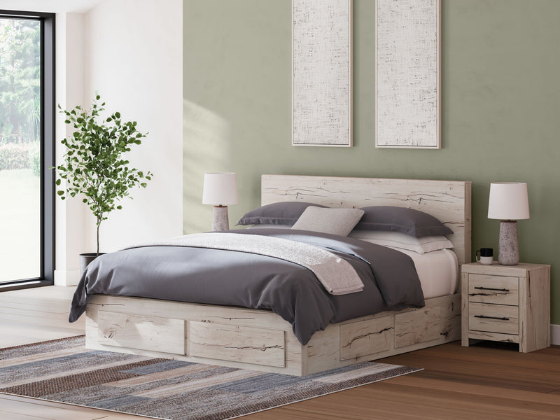Signature Design by Ashley Lawroy panel bed with built-in storage drawers in a modern bedroom setting.