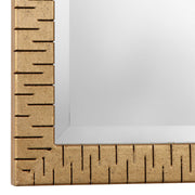 Uttermost Vilmos metallic gold wall mirror with a stylish round frame, reflecting modern interior decor.