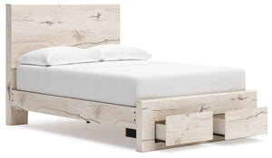 Signature Design by Ashley Lawroy Panel Bed with built-in storage drawers in a dark wood finish, showcasing a modern bedroom setup.