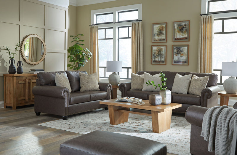 Benchcraft Roxmere living room set with stationary chair and matching ottoman, showcasing comfortable upholstered furniture.