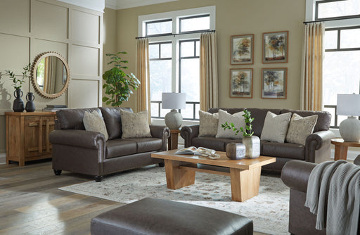 Benchcraft Roxmere living room set with stationary chair and matching ottoman, showcasing comfortable upholstered furniture.