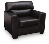 Midnight-colored Glennbre armchair by Signature Design Ashley, featuring plush upholstery and modern armchair design.