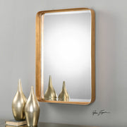 Uttermost Crofton wall mirror with antique gold finish and ornate frame, showcasing a decorative, elegant wall decor piece.