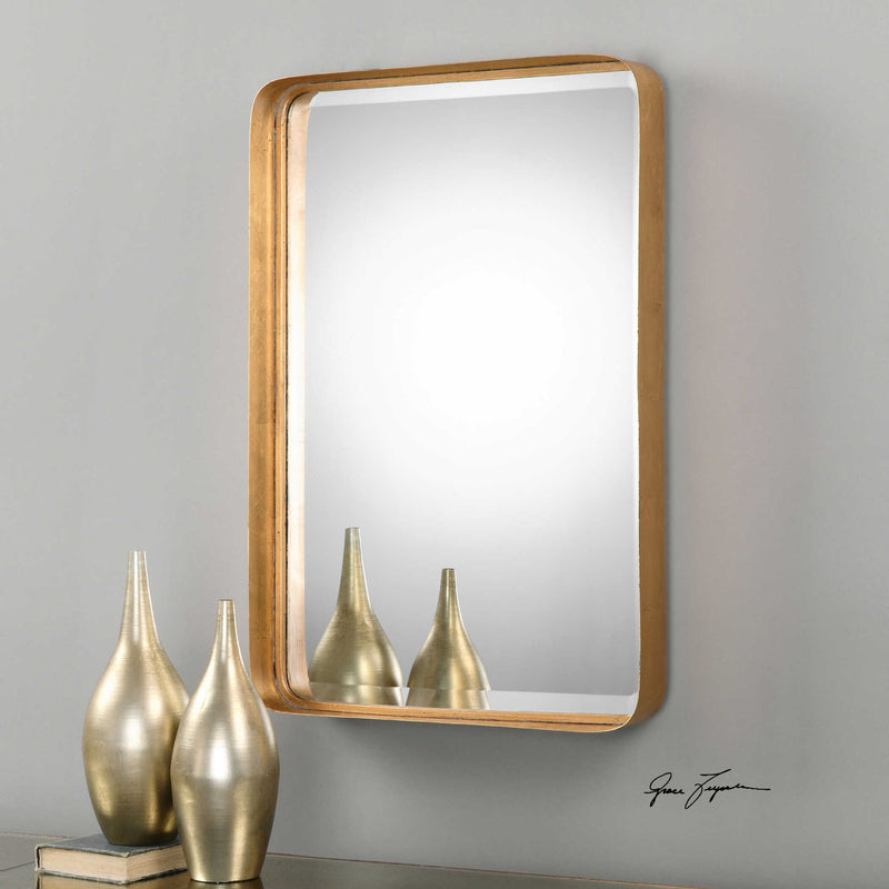 Uttermost Crofton wall mirror with antique gold finish and ornate frame, showcasing a decorative, elegant wall decor piece.