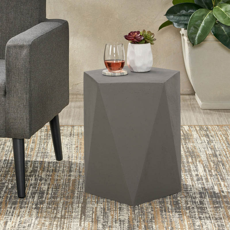 Noble House side table with geometric design, featuring a modern, stylish frame and a flat surface for versatile use.