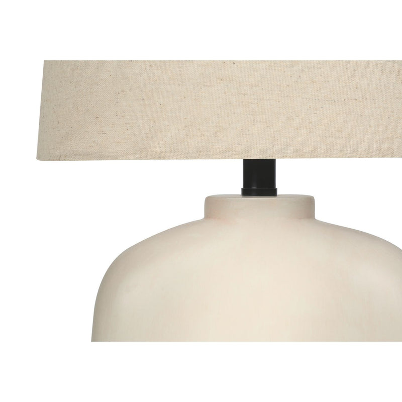 Modern cream resin table lamp by 8th Street featuring a sleek, minimalist design for stylish home lighting.