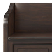 Simpli-Home Connaught storage bench with cushioned top and wooden legs, ideal for entryways or living room storage.