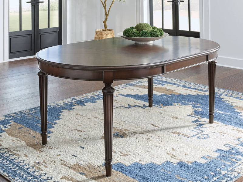 Lavinton - Oval Dining Room Extension Table - Brown - R&R Furniture Gallery (Fountain Valley, CA)
