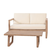 Noble House 4-piece acacia wood outdoor patio furniture set with beige cushions, includes chairs and coffee table for backyard or porch.