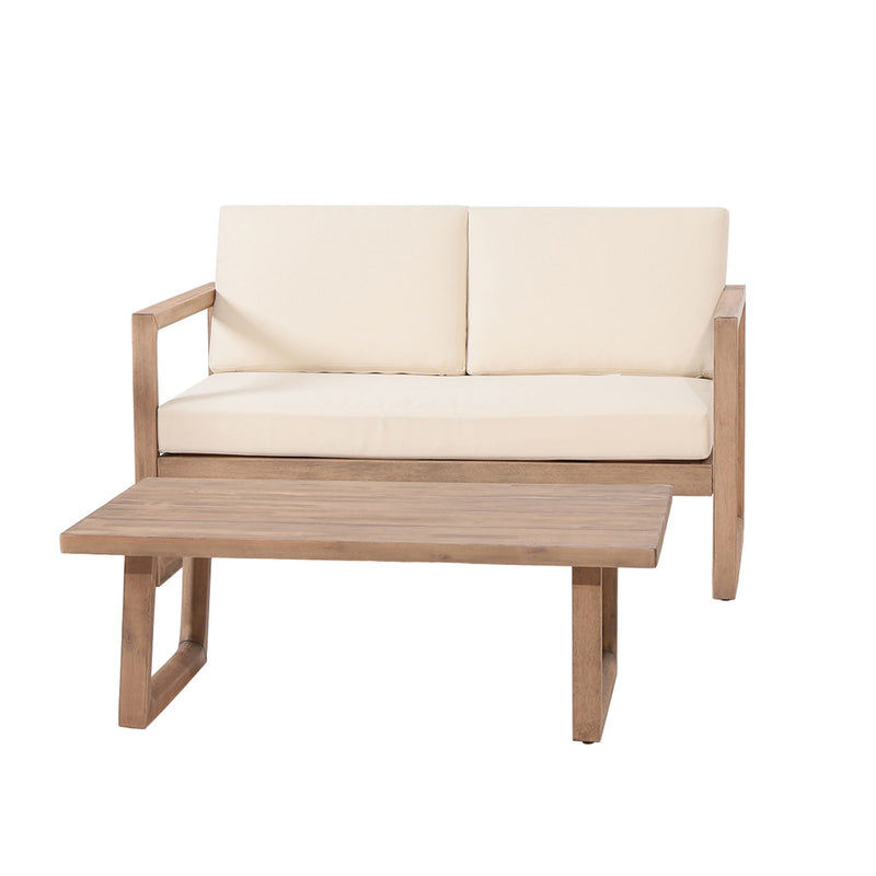 Noble House 4-piece acacia wood outdoor patio furniture set with beige cushions, includes chairs and coffee table for backyard or porch.