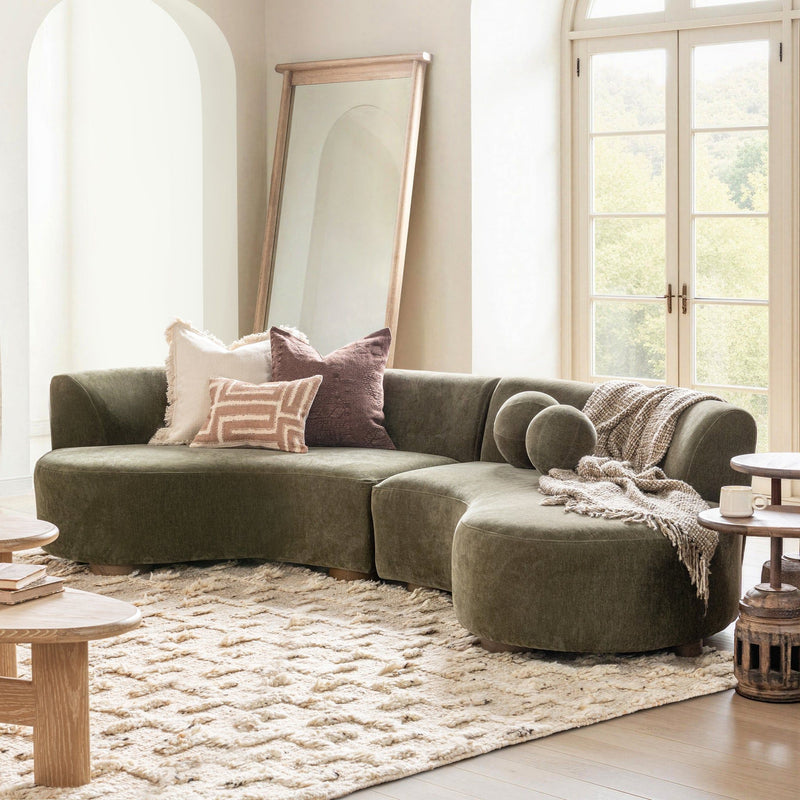 Classic Home Octavia sectional sofa, stationary sectional with plush cushions and modern design, shown in a cozy living room setting.