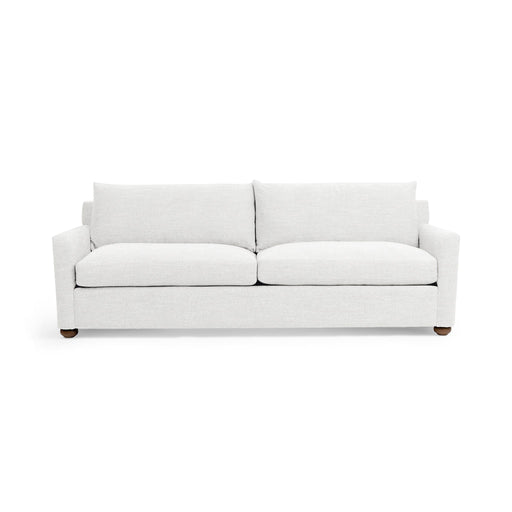 Olivia stationary sofa by Classic Home featuring plush beige fabric, wide armrests, and cushioned seating in a modern living room setting.