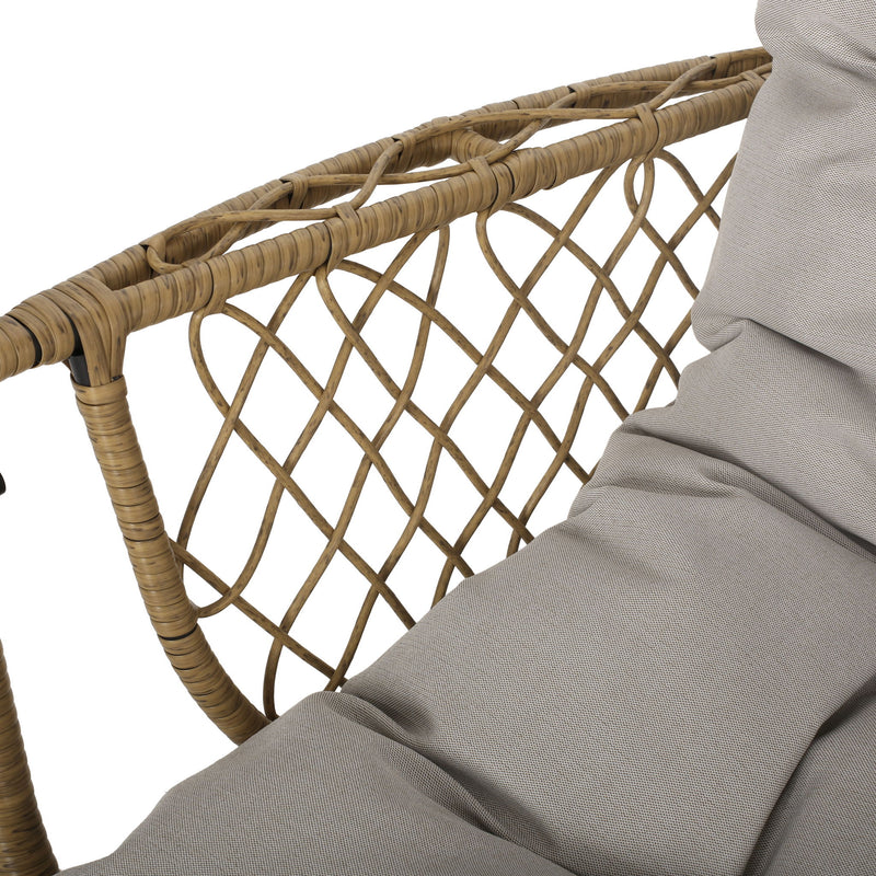 Light brown wicker hanging chair with beige cushions and 8-foot chain, ideal for outdoor or indoor relaxation, by Noble House.
