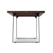 Simpli-Home Delta handcrafted dining table with wooden surface and sturdy legs, perfect for modern dining rooms.
