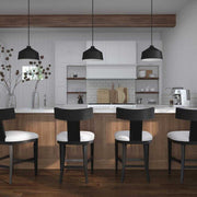 Uttermost Holgate black 1-light pendant lighting fixture with a sleek, modern design hanging from a ceiling.