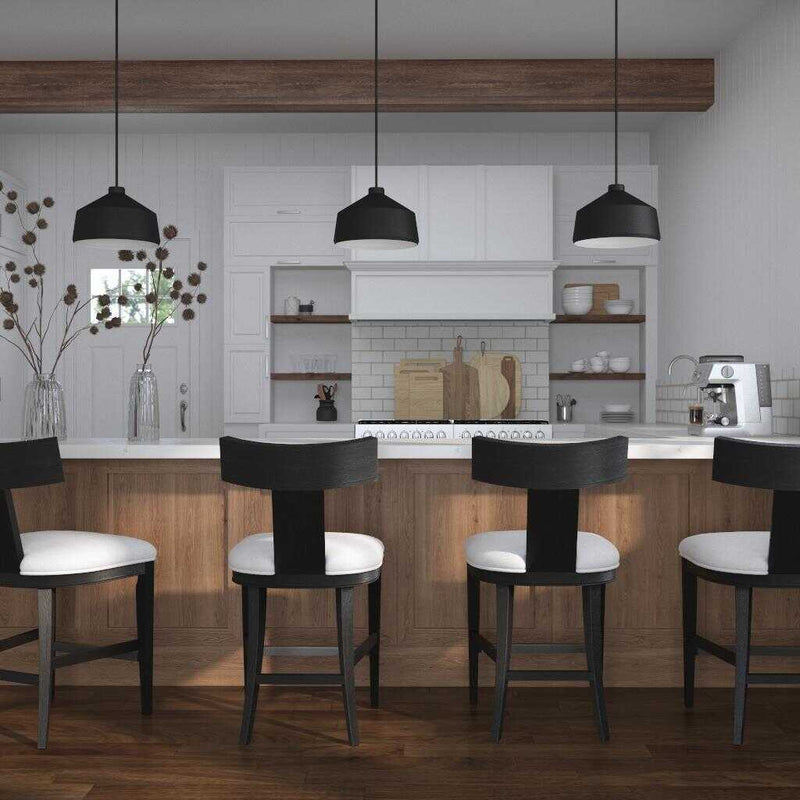 Uttermost Holgate black 1-light pendant lighting fixture with a sleek, modern design hanging from a ceiling.