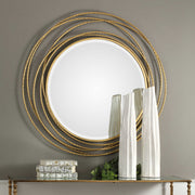 Uttermost Whirlwind round wall mirror with a modern, swirling frame, perfect for contemporary interior decor.