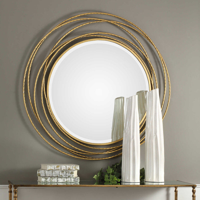 Uttermost Whirlwind round wall mirror with a modern, swirling frame, perfect for contemporary interior decor.
