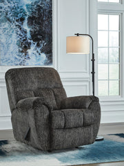 Signature Design by Ashley Stayfish rocker recliner with plush cushioning and wood arm accents, perfect for relaxing in a stylish rocker chair.