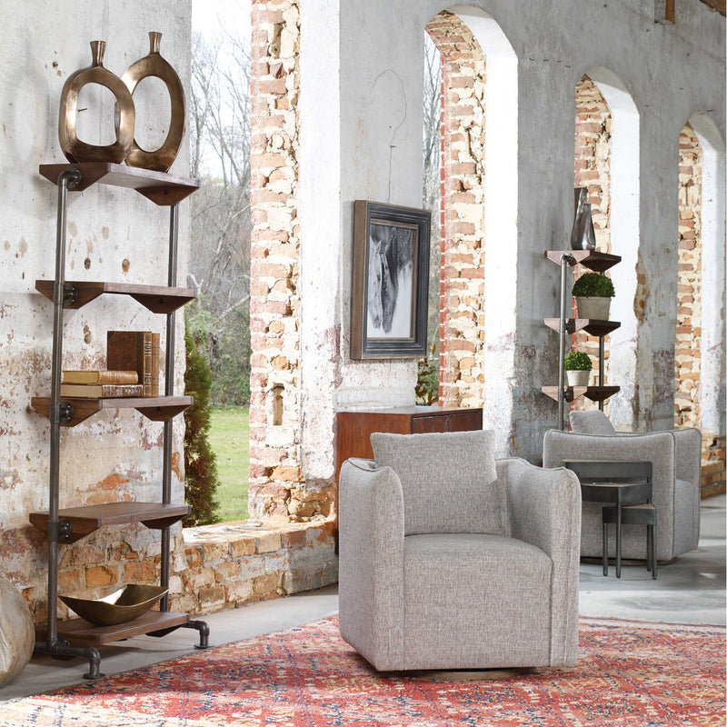 Uttermost Corben swivel chair with plush fabric upholstery and a modern design, featuring a swivel base and stylish armrests.