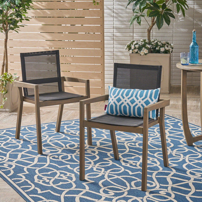 Set of two Noble House Belfast dining chairs with acacia wood frames and cushioned seats, showcasing stylish, modern kitchen seating.