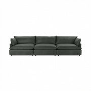 Classic Home Caplan modular sectional sofa with beige fabric upholstery, featuring multiple seating sections and plush cushions.