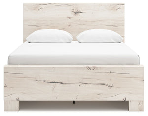 Signature Design by Ashley Lawroy panel bed with built-in storage drawers in a modern bedroom setting.