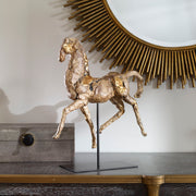 Gold horse sculpture by Uttermost, detailed Caballo figurine with a shiny gold finish, perfect for decorative sculptures and figurines.