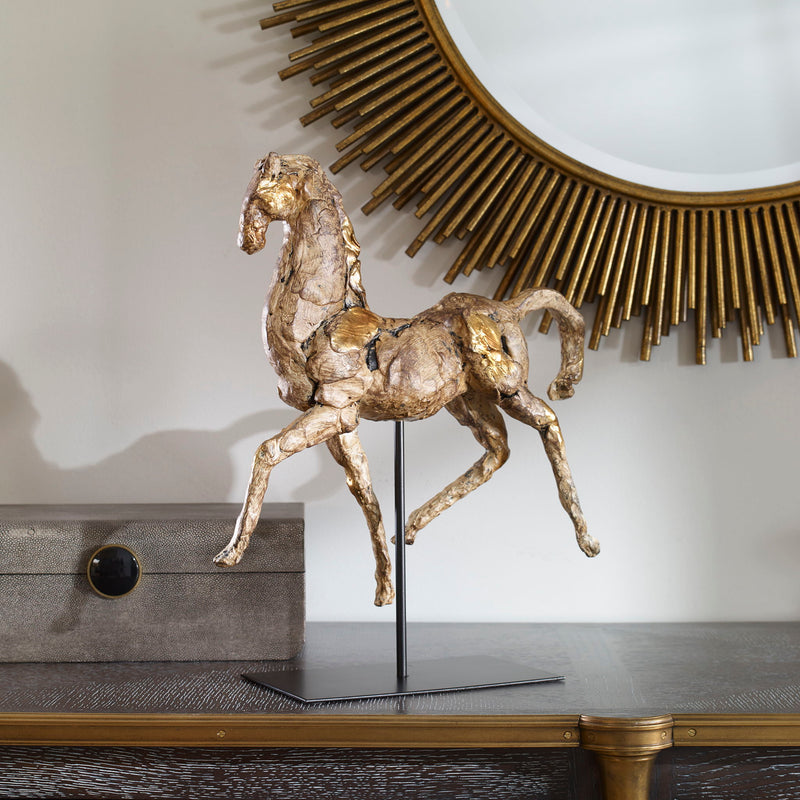 Gold horse sculpture by Uttermost, detailed Caballo figurine with a shiny gold finish, perfect for decorative sculptures and figurines.