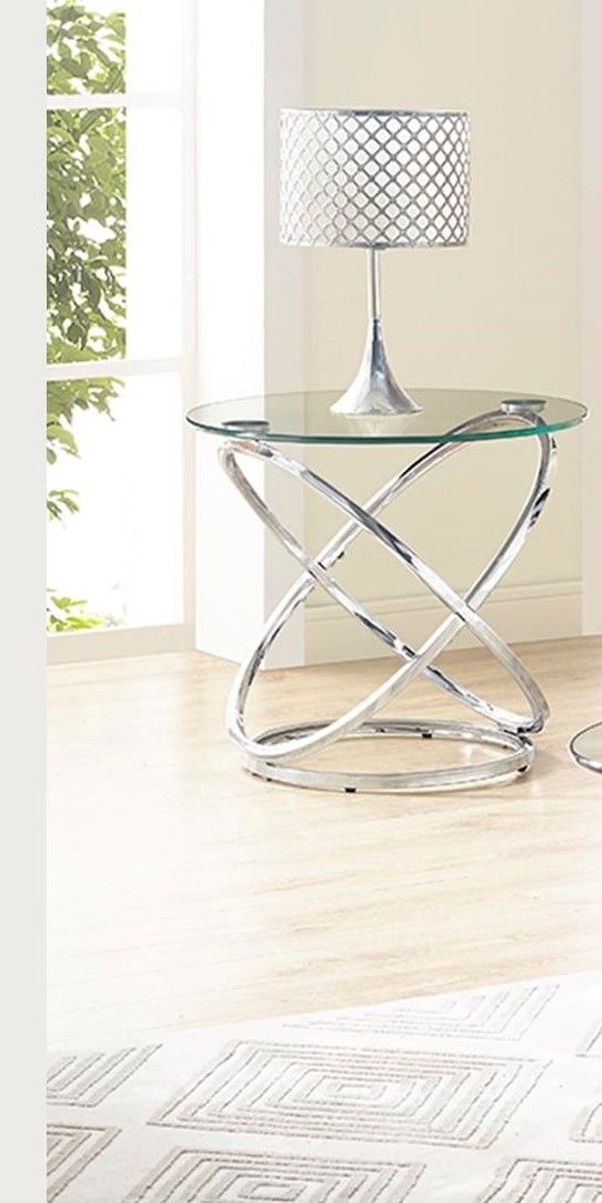 Modern chrome cocktail table set by Bernards Furniture, featuring sleek round tables with reflective chrome finishes.