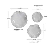 Set of three ceramic wall decor pieces by Uttermost featuring modern abstract designs for stylish wall accents.