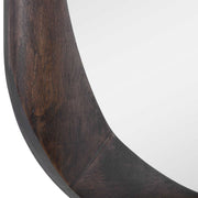 Dark brown Sheldon Mid-Century wall mirror by Uttermost featuring a sleek, modern design with a round frame and reflective glass surface.