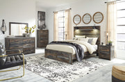 Signature Design by Ashley Drystan two-drawer night stand in brown and beige with a modern accent design and sleek drawer handles.
