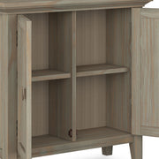 Redmond handcrafted low storage accent cabinet by Simpli-Home with a rich wood finish and sleek design.