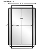 Uttermost Amherst wall mirror with a sleek, modern frame, hanging on a wall, reflecting a stylish interior.