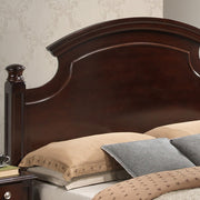 Hand-carved traditional panel bed by Glory Furniture featuring intricate woodwork and classic design elements.
