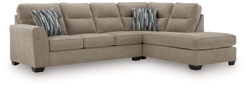 Benchcraft Olten stationary sectional sofa with plush cushions and neutral fabric, showcasing a modern living room setup.