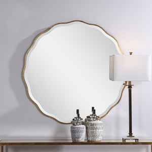 Uttermost Aneta round wall mirror with a sleek, modern frame hanging on a wall in a stylish home interior.