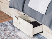 Signature Design by Ashley Lawroy panel bed with built-in storage drawers in a modern bedroom setting.