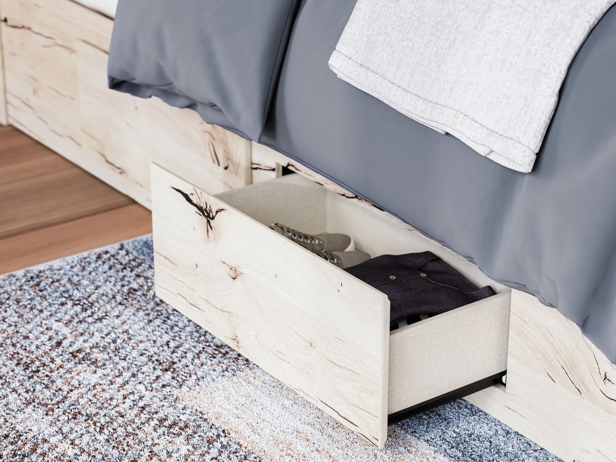 Signature Design by Ashley Lawroy panel bed with built-in storage drawers in a modern bedroom setting.