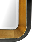 Gold metallic wall mirror by Uttermost, featuring a sleek, modern design with a round shape and reflective surface.