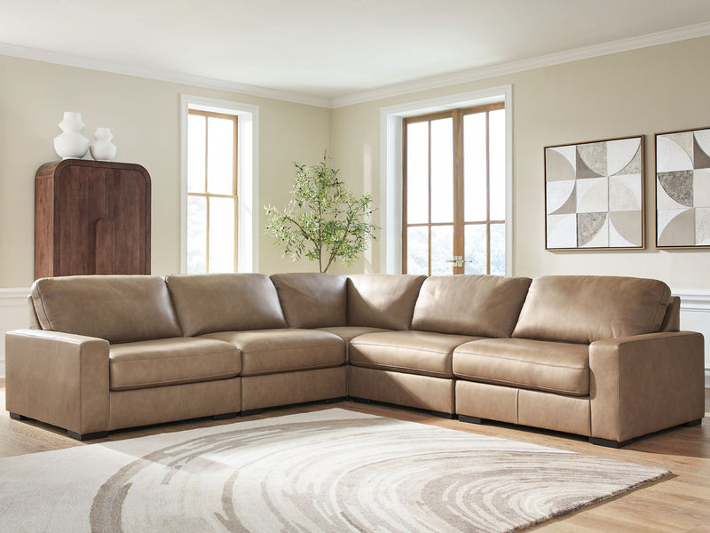 Benchcraft Veronella stationary sectional sofa with plush cushions and modern design in a cozy living room setting.