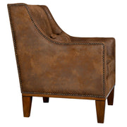 Dark brown leather armchair by Uttermost featuring a classic design and plush cushioning, perfect for living room seating.