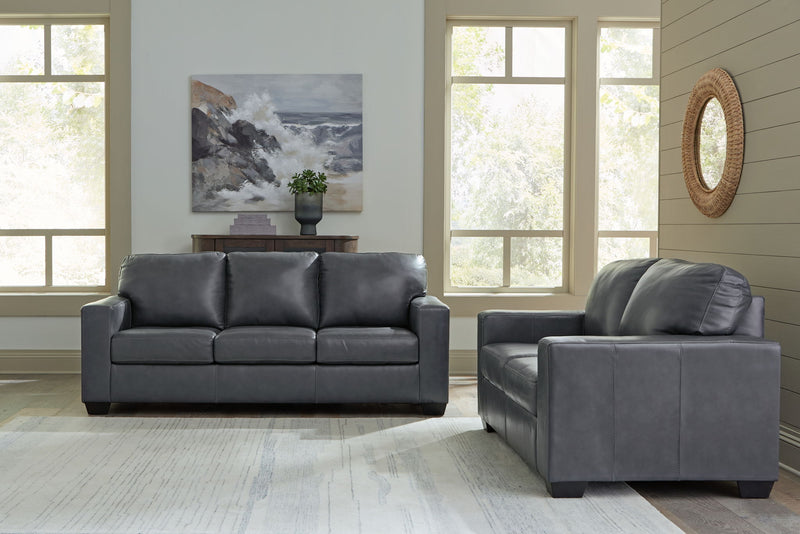 Signature Design by Ashley Bolsena living room set with stationary sofas and loveseats in a modern fabric, arranged in a cozy living space.