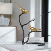 Black and gold Birds On A Limb sculpture by Uttermost featuring detailed bird figurines perched on a branch.