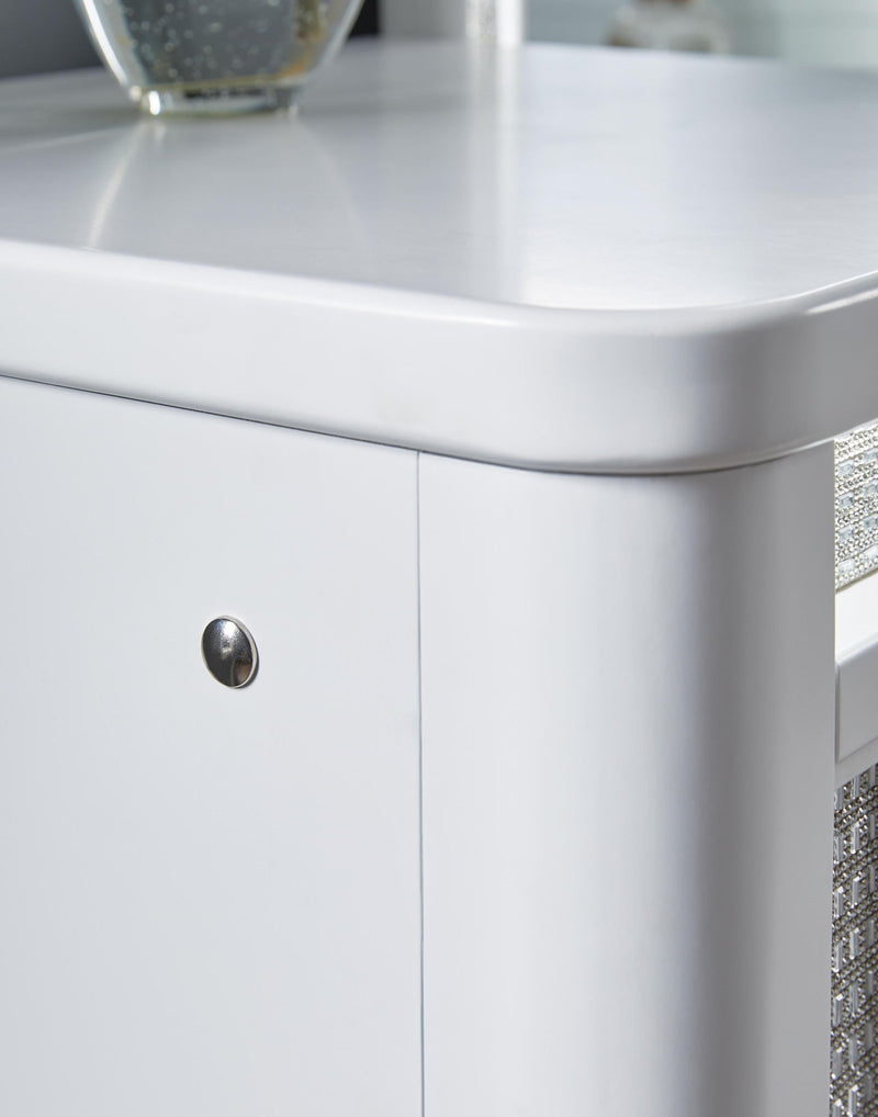 White Signature Design by Ashley Chalanna vanity set with mirror, featuring a sleek modern design with a spacious tabletop and storage drawers.