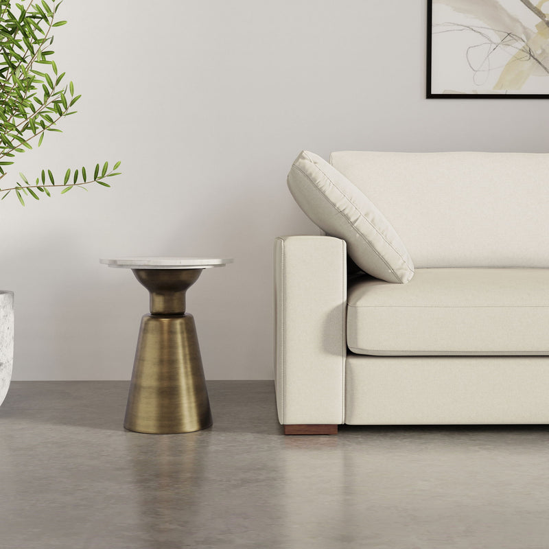 Leyla side table by Simpli-Home with antique brass finish, featuring a sleek round top and modern minimalist design.