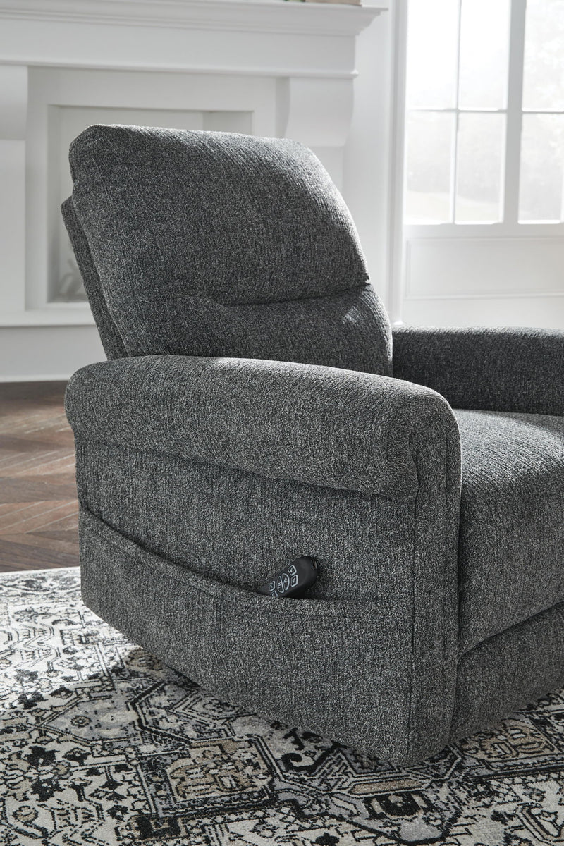Signature Design by Ashley Aureta Power Lift Recliner in neutral fabric with padded armrests and plush cushioning.
