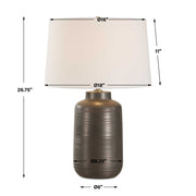 Uttermost Calderone bronze table lamp with a rounded base and fabric shade, perfect for modern or contemporary decor.