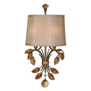 Uttermost Alenya 2-light gold wall sconce with sleek, modern design and elegant finish, mounted on a neutral wall.
